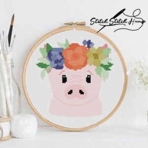 Cute pink pig wearing a colorful floral wreath cross stitch pattern for farmhouse decor