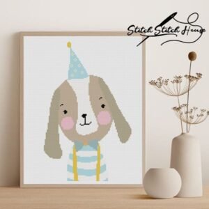 Handmade cross stitch pattern of a cute brown and white dog wearing a light blue party hat and striped shirt