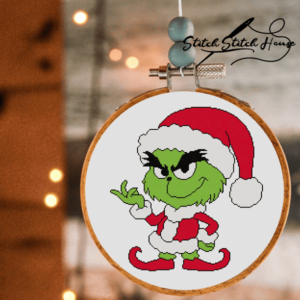 Funny Grinch wearing Santa hat and suit handmade cross stitch pattern design